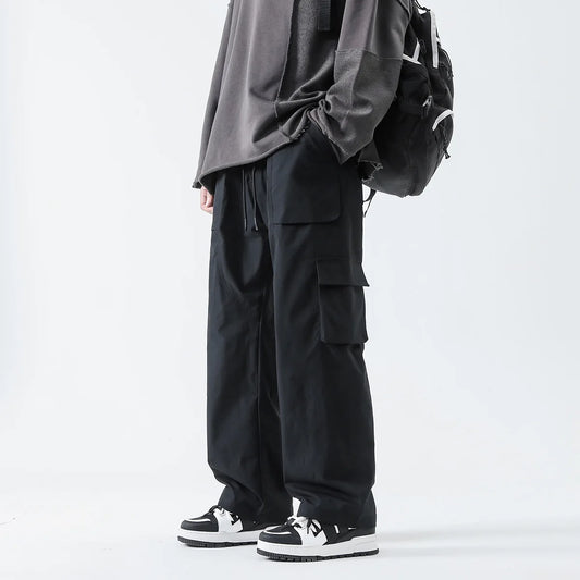 Pantalones Cargo de Hip Hop para hombre y mujer, ropa de calle con múltiples bolsillos, pantalones Harem de cintura elástica, pantalones de chándal casuales Harajuku
